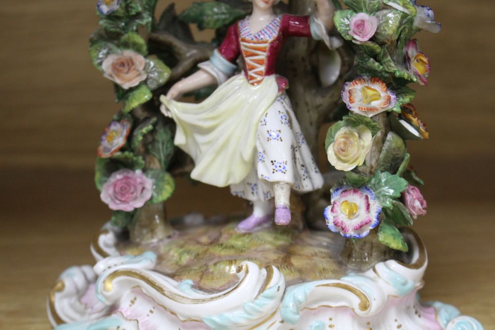 A pair of Meissen figural candlesticks, late 19th century, H.12cm
